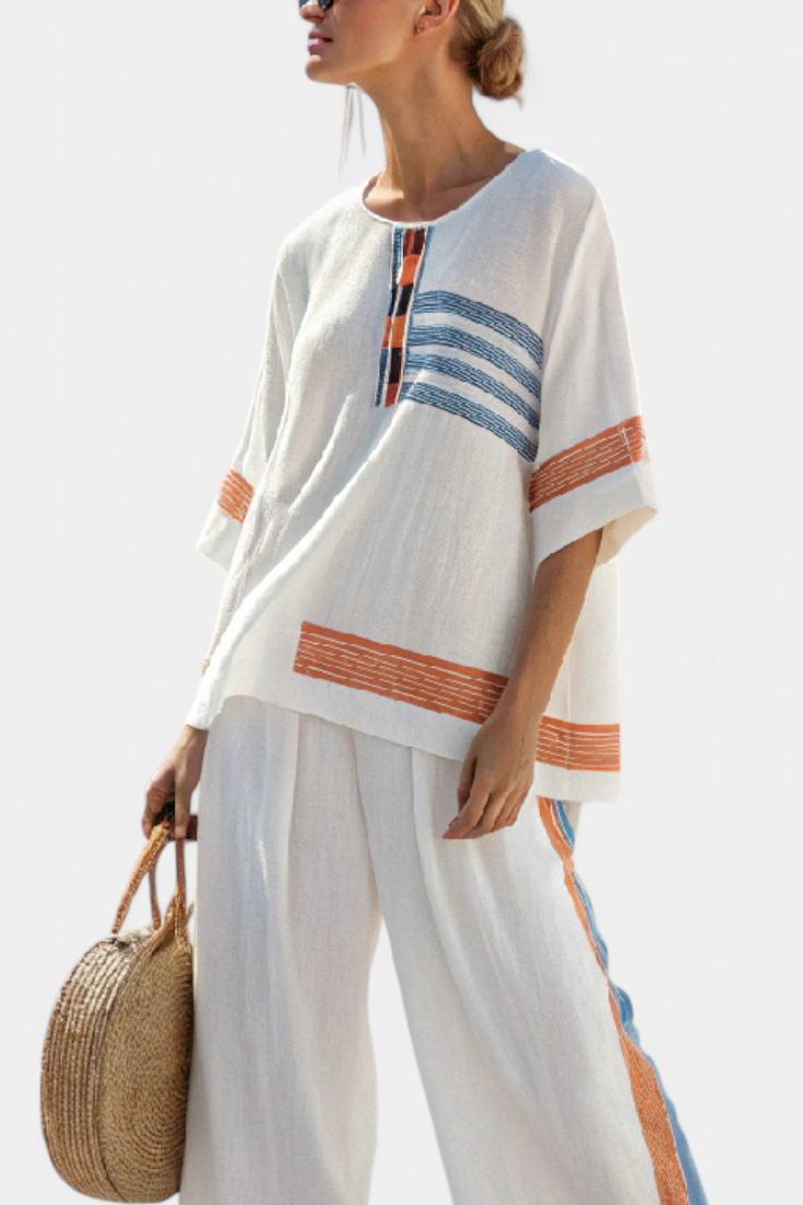 Complete ethnic Daisy in white with blue and orange striped details – unique and vibrant style