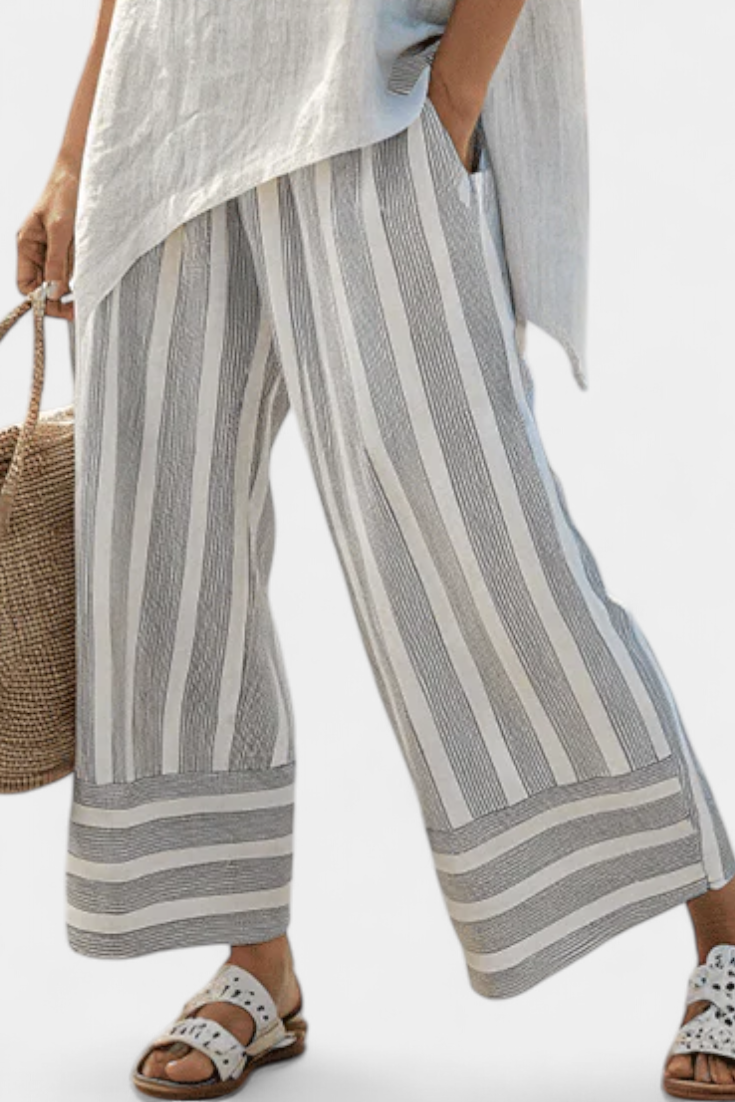 Daisy Set of Asymmetrical Blouse and Striped Pants for a Modern and Elegant Style