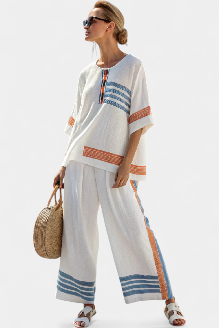 Complete ethnic Daisy in white with blue and orange striped details – unique and vibrant style