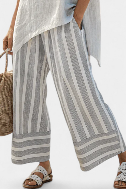 Daisy Set of Asymmetrical Blouse and Striped Pants for a Modern and Elegant Style